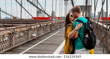NEW YORK, SEPT 22: Unidentified people kiss on brooklyn bridge on September 22 2011 in New York, USA.