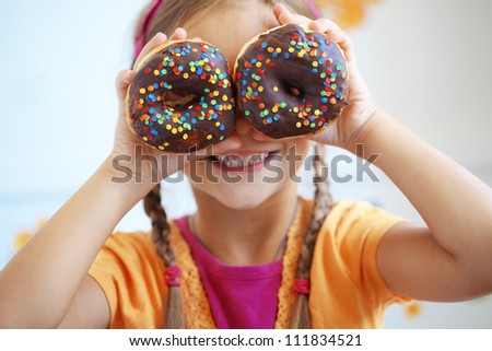 Cute Kid Girl Eating Sweet Donuts Stock Photo 111834521 ...