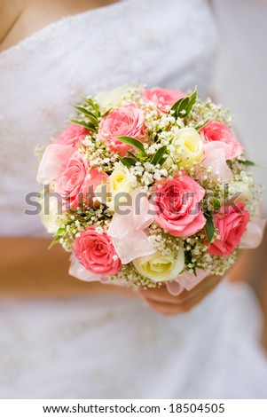 stock photo Wedding bouquet with white and pink roses in bride hand