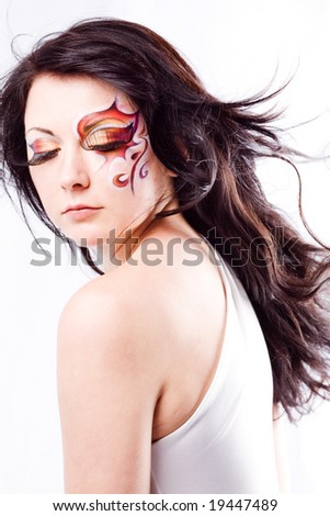 stock photo Beautiful fashion model with faceart and long hair on white