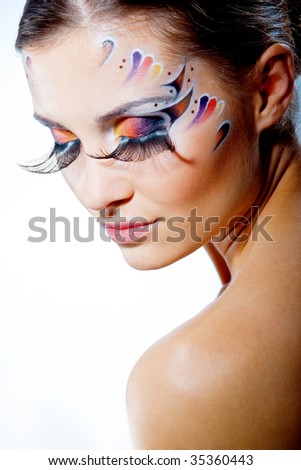 stock photo Fashion makeup with face art and extra long lashes Model