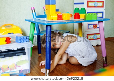 Playful child in her nursery at home