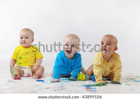 Group of babies painting on white background