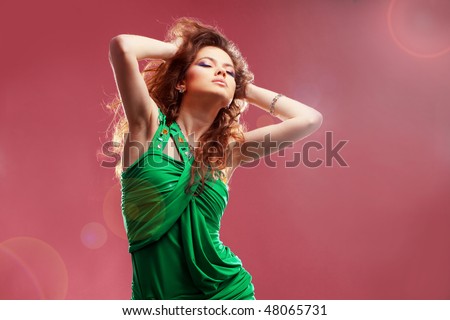 Fashion expressive girl dancing at disco light