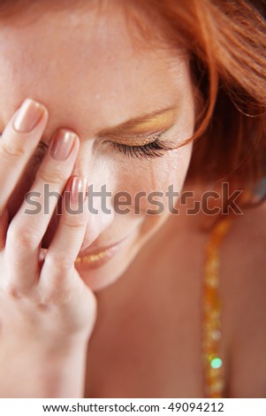 Closeup of crying woman with tears