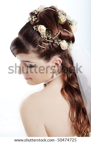 Fashion bridal hairstyle with floral decoration