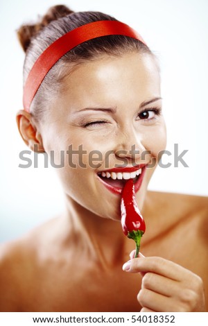 stock photo Beautiful woman with red lips holding chilli pepper