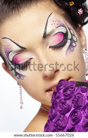 stock photo Fashion makeup with face art and hairstyle Model isolated on