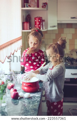5 years old twins cooking holiday pie in the kitchen, casual lifestyle photo series in real life interior