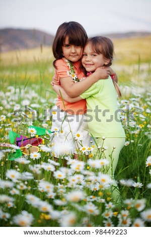 Portrait of little friends hugging