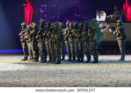stock photo : WINDSOR - MAY 13: Royal Marine Commandos salute the royal box 