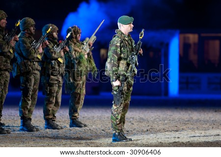 stock photo : WINDSOR - MAY 16: Royal Marine Commandos salute the royal box 