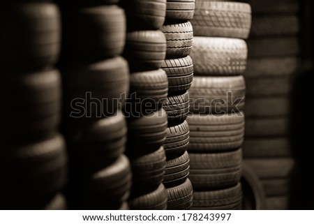 Car tyres stacked in a tyre distribution centre