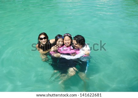 happy family in pool