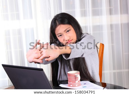 young woman is working on the personal computer at the internet cafe  or office