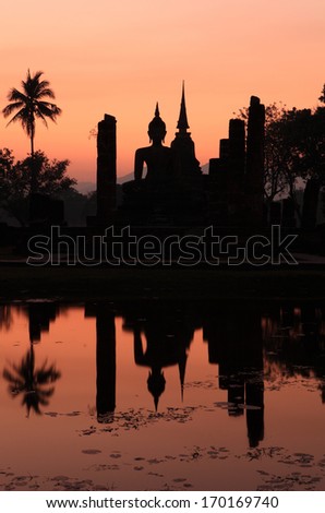 Silhouette Buddha Statue in Wat Mahathat Temple in Sukhothai Historical Park, Sukhothai Province, Thailand .