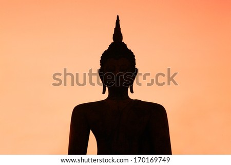 Silhouette Buddha Statue in Wat Mahathat Temple in Sukhothai Historical Park, Sukhothai Province, Thailand .
