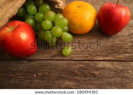 Vintage Autumn border from apples and fruits  on old wooden table/Thanksgiving day concept/background with apples