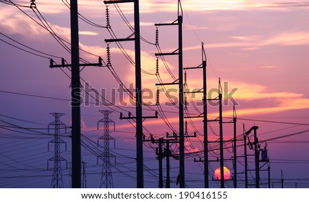 Impression network at transformer station in sunrise, high voltage up to full color sky take with sunset  tone, horizontal frame