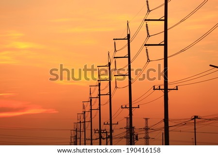 Impression network at transformer station in sunrise, high voltage up to full color sky take with sunset  tone, horizontal frame