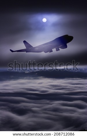 perspective view of jet airliner in flight on sky over cloud at sunrise time it\'s very beautiful , use for air transport ,journey and travel industry business