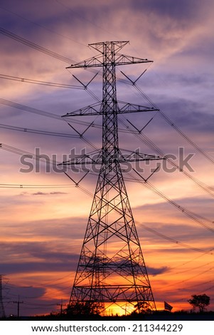 Impression network at transformer station in sunrise, high voltage up to full color sky take with sunset tone
