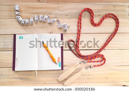 fitness equipment isolated on wood  background