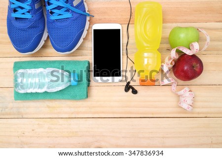 Sport shoes and water with set for sports activities on tiled floor.sports, fitness, concept of weight loss
