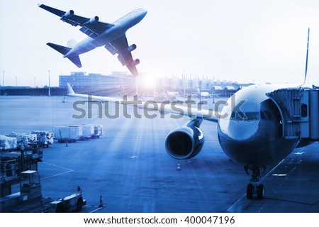 Airplane at the terminal gate , Modern international airport during sunset - Concept of freight cargo plane in transport and import-export commercial logistic ,shipping business industry