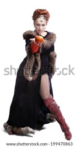 young beautiful girl in the character of a witch with apple,isolated on white background