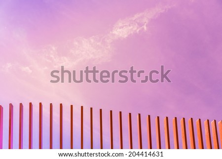 Concept purple pink sky color background with fence