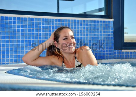 woman in a jacuzzi completely relaxed and enjoying the water