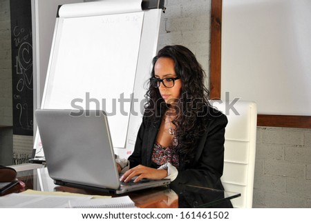 secretary in his office working with your computer
