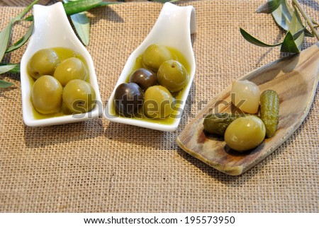 green and black olives with olive oil