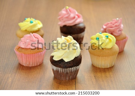 mini cupcakes in various flavors with cup of coffee