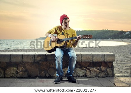 modern musician posing with his Spanish guitar