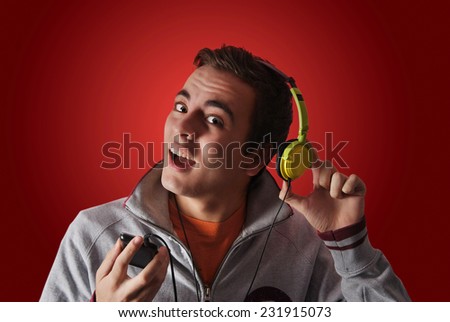 young man listening to music with headphones