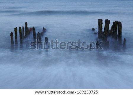 A groin in the North Sea (Rantum, Sylt= in the evening. This shot is a long time exposure. The water rinses back in long strains.
