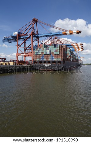 HAMBURG, GERMANY - MAY, 03. The container vessel Zim Rotterdam is loaded/unloaded at the container terminal Eurokai in Hamburg-Waltershof on May 3 2014, .