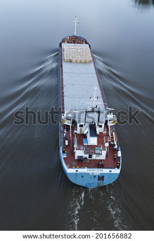 BELDORF, GERMANY - JUNE, 15. General cargo ship Paper Star at the Kiel Canal (Schleswig-Holstein, Germany) taken on June 15, 2014.