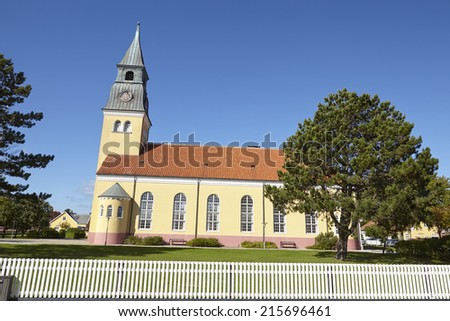 The church at Skagen (Denmark, North Jutland) is built in the typical architectural style and colors with ochraceous walls, a red roof and white joint.