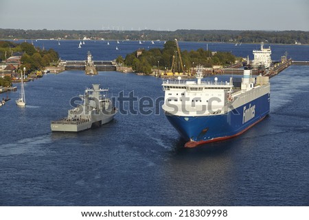KIEL, GERMANY - SEPTEMBER, 3. The Ro-ro cargo vessel Finnbreeze and naval vessel Erfurt at the Kiel Canal near the lock Kiel-Holtenau taken on September 3, 2014.