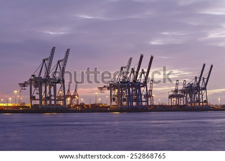 HAMBURG, GERMANY - FEBRUARY, 8. The Port of Hamburg (Germany) with container gantry cranes and terminals taken on February 8, 2015.