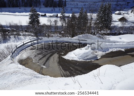 An U-turn of a switchback (road) with much of snow in the Swiss canton Ticino (Tessin) taken in winter near the Gotthard massif,