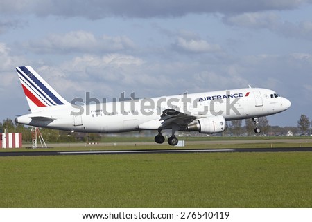 AMSTERDAM, THE NETHERLANDS - MAY, 7. An Airbus A320-214 of Air France lands at Amsterdam Airport Schiphol (The Netherlands, AMS) on May 7, 2015. The name of the runway is Polderbaan.