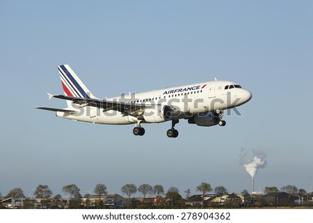 AMSTERDAM, THE NETHERLANDS - MAY, 7. An Airbus A319-111 of Air France lands at Amsterdam Airport Schiphol (The Netherlands, AMS) on May 7, 2015. The name of the runway is Polderbaan.