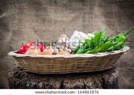 Vegetables and egg . Fresh Bio Vegetable in a Basket. Over Nature Background