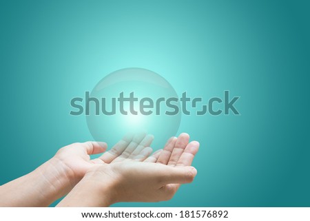 Business hand holding a glowing crystal ball