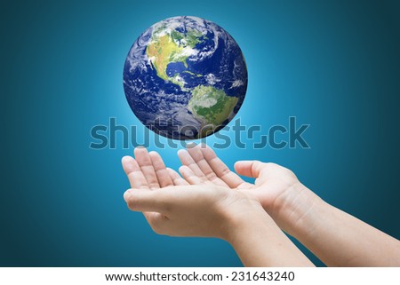 Businessman hand holding globe with Earth in the background \