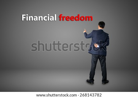 business hand writing Financial freedom